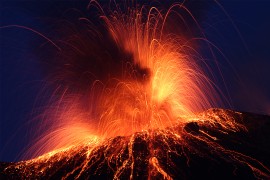 Stromboli volcano erupting at night