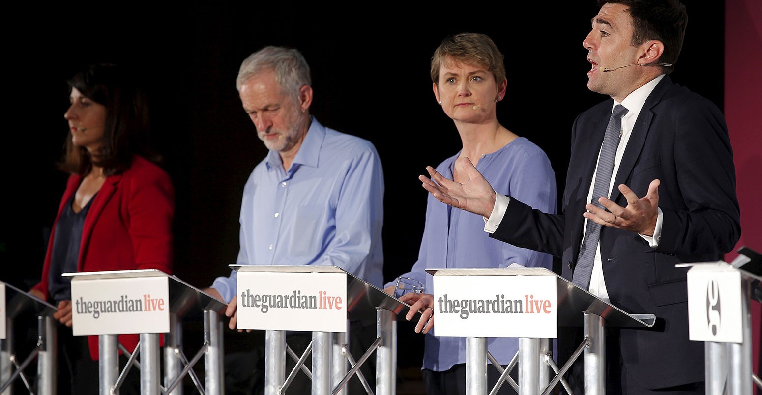 Labour Party leadership candidates Liz Kendall, Jeremy Corbyn and Yvette Cooper listen as rival candidate Andy Burnham speaks at a leadership debate