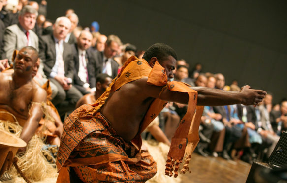 Representatives from Fiji perform a traditional ceremony, known as the Qaloqalovi, to open the meeting.