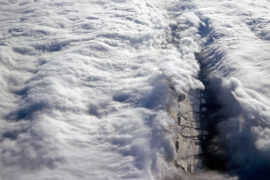 B6P8JD Aerial view of dramatic white clouds against a blue sky