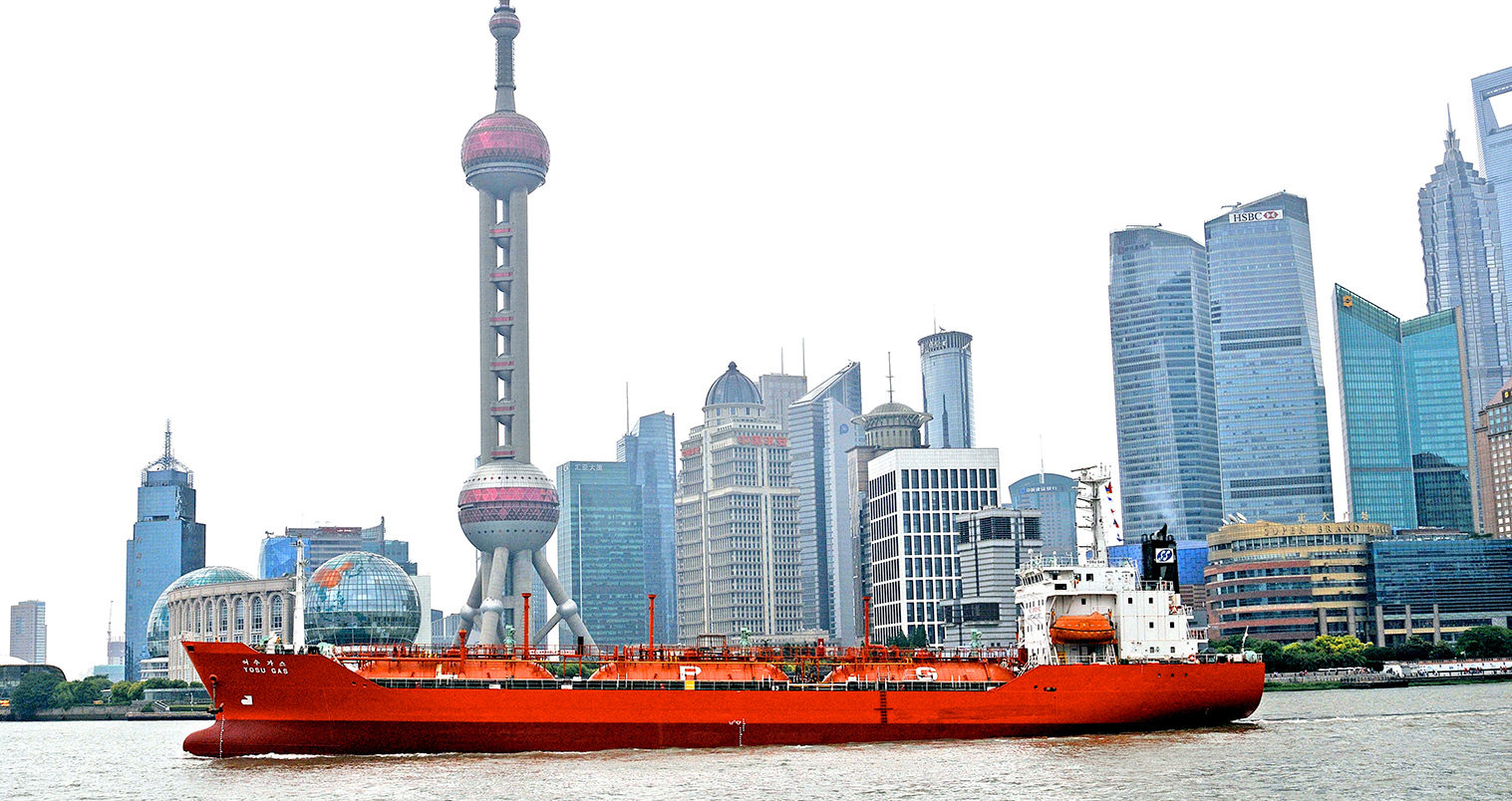 Yosu Gas ship on Huangpu river before the skyline of Pudong, Shanghai, China.