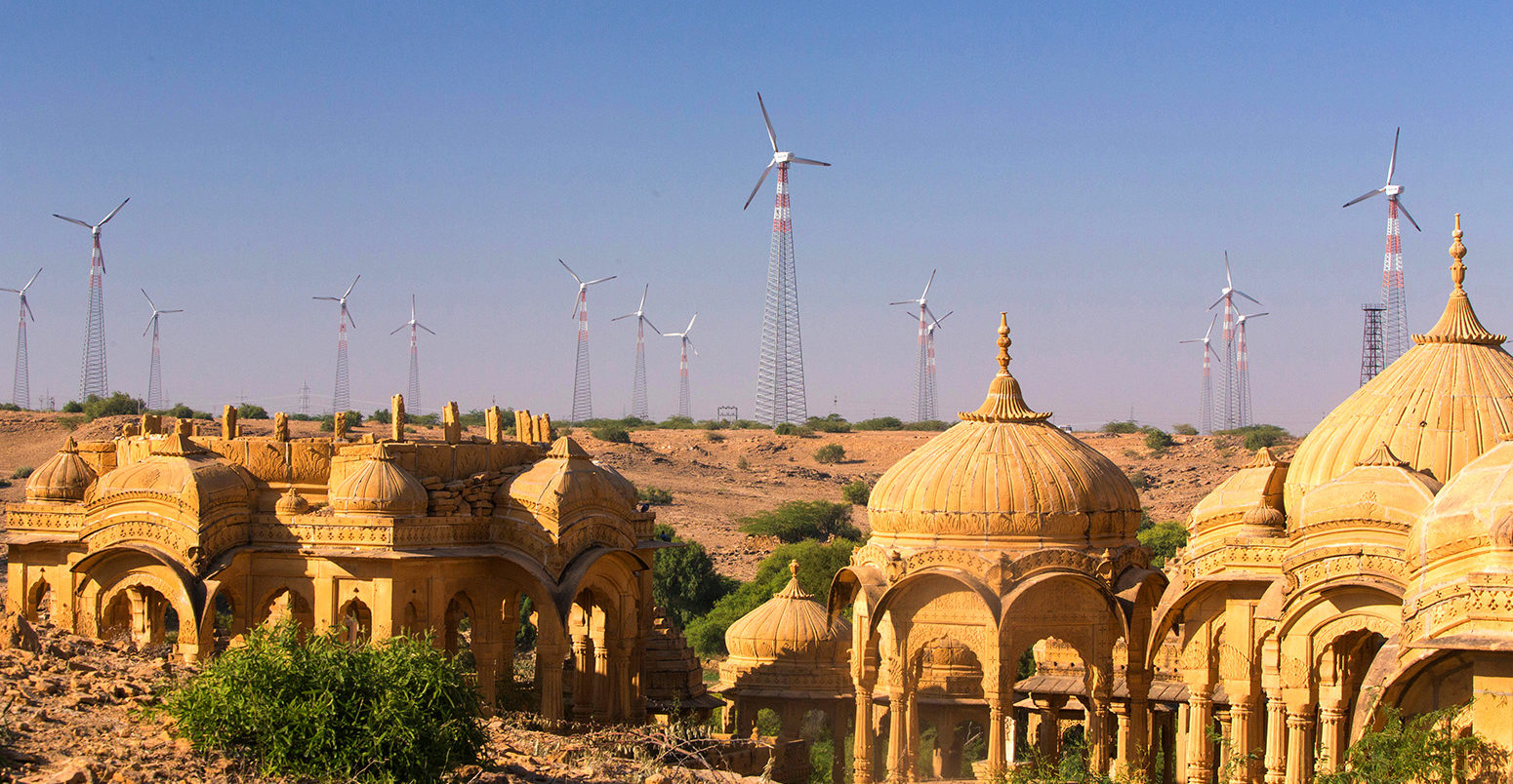 Wind turbines line the horizon behind Bada Bagh in Rajasthan, India. Credit: Prisma by Dukas Presseagentur GmbH / Alamy Stock Photo. DY917M