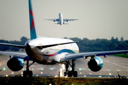 A plane prepares for takeoff from London Gatwick airport at dawn. Credit: Roger Bamber / Alamy Stock Photo. AM1G59