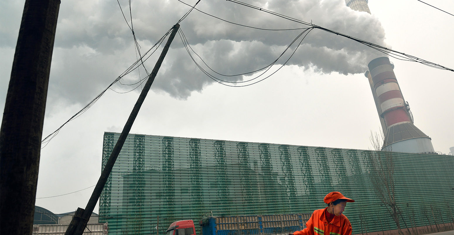 A steel factory emits smoke in Tangshan, Hebei province, China. Credit: Lou Linwei / Alamy Stock Photo.