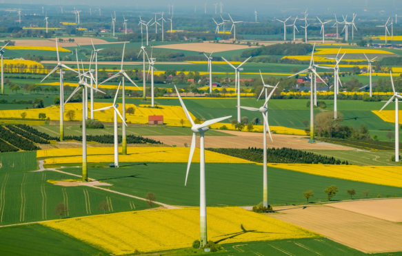 Wind-farm-and-rapeseed-fields-on-the-town-borders-between-Warstein-Belecke-and-Anrochte-Erwitte,-Germany