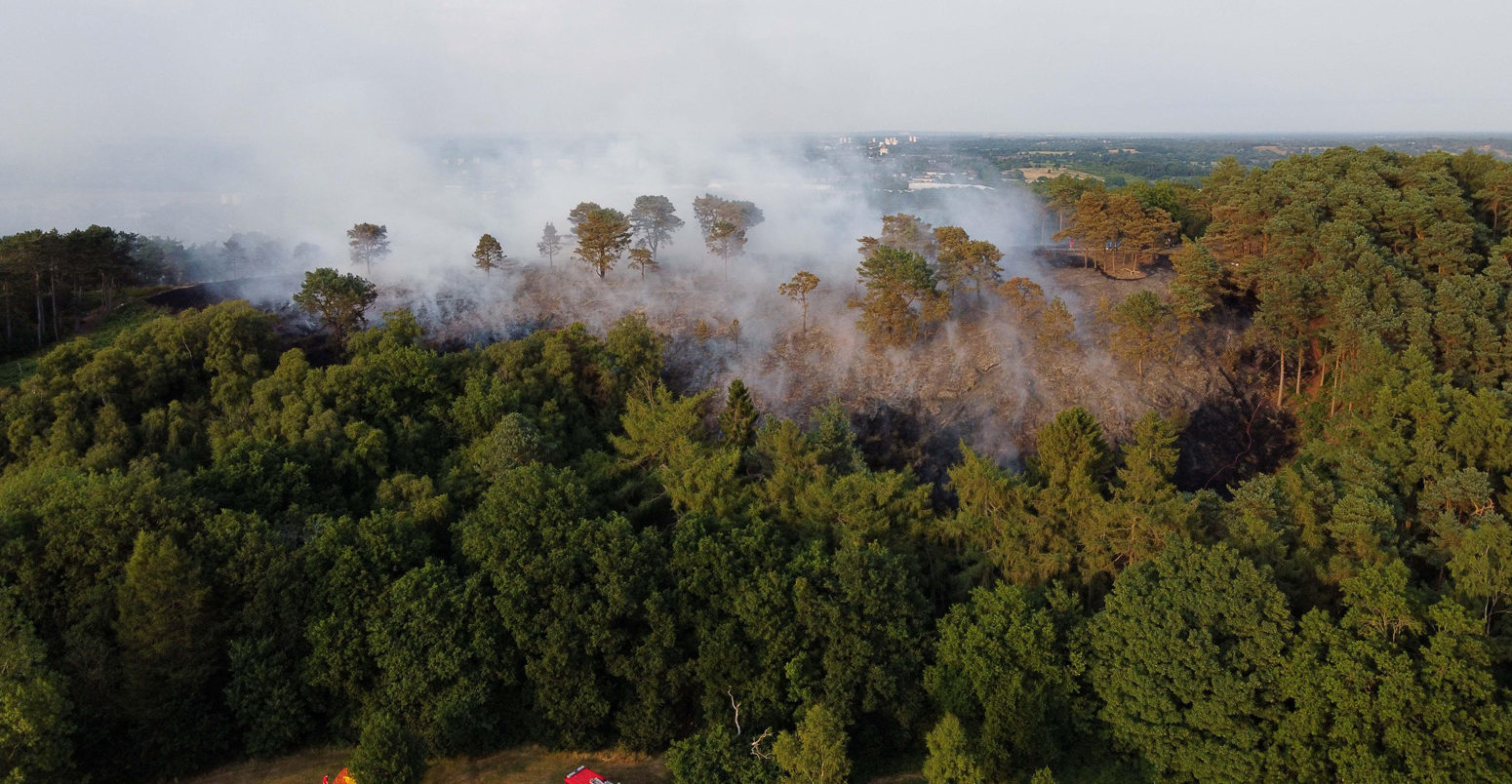 Firefighters respond to a large wildfire at the edge of Birmingham, UK during the July 2022 heatwave