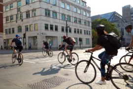 Cyclists crossing Lower Thames Street in London, UK, 2021.