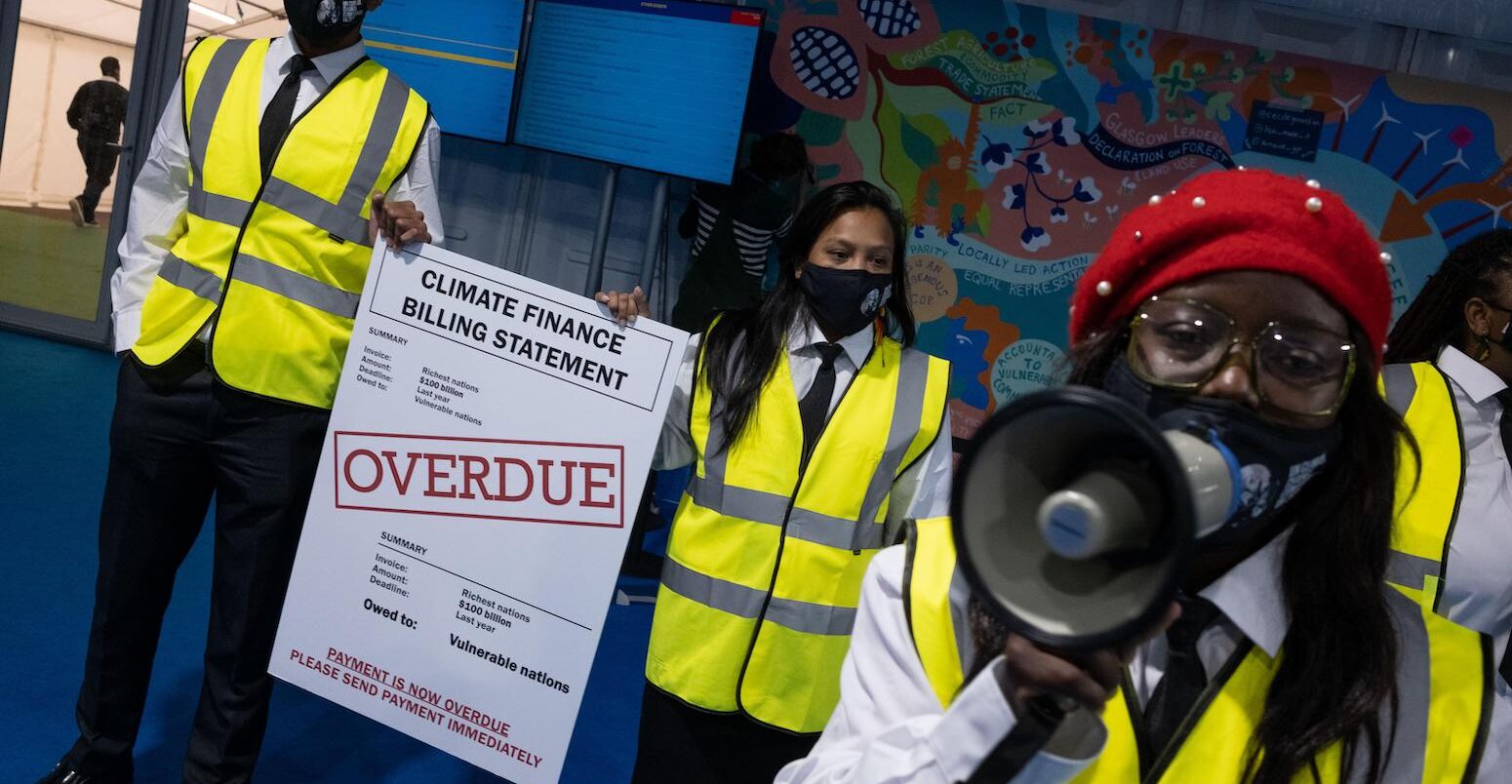 Protest inside the COP26 venue, Glasgow, Scotland, 11 November 2021.