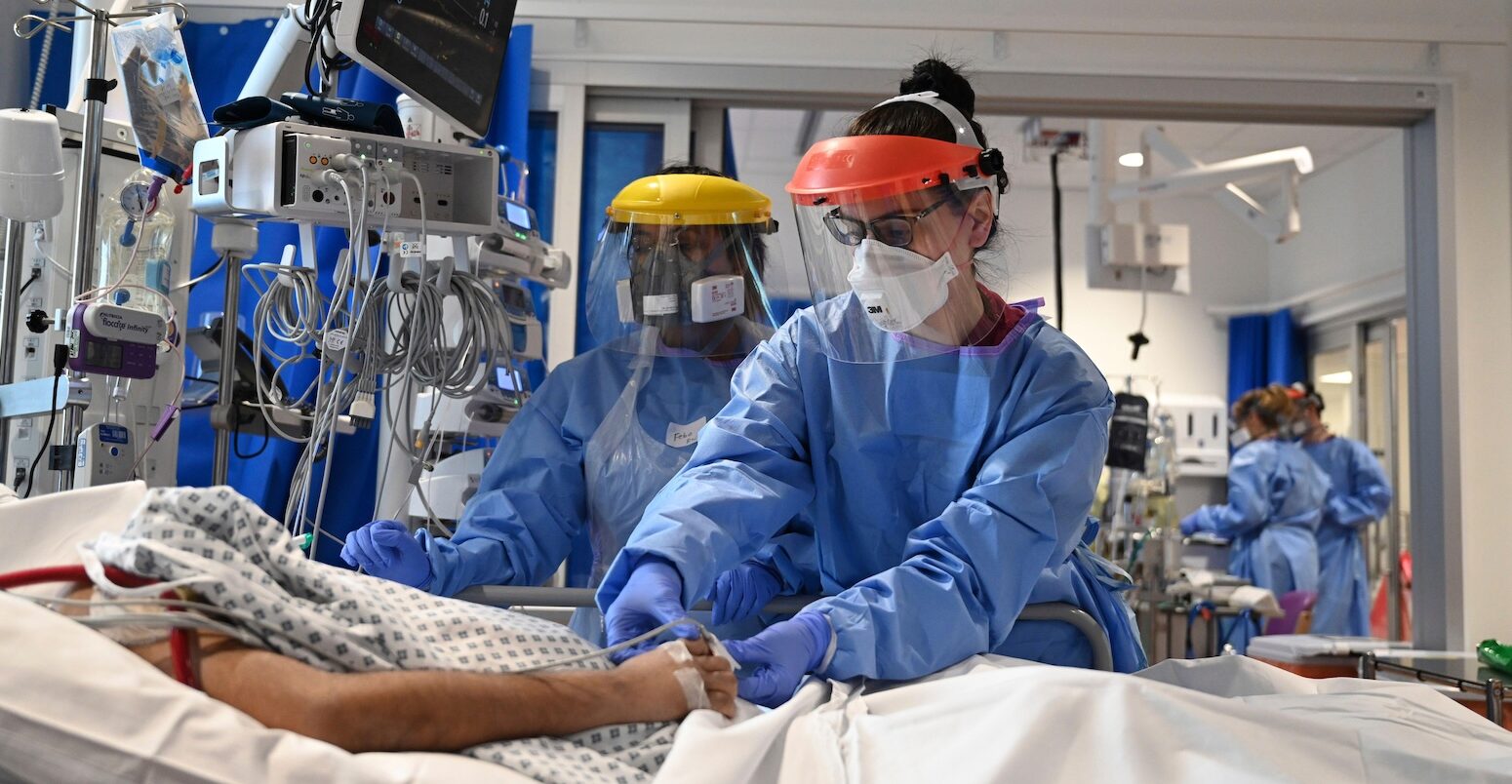 Medical personnel tend to a patient with COVID-19 in intensive care Cambridge, UK.