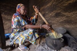 A woman cooking over a fire in Mali, West Africa.