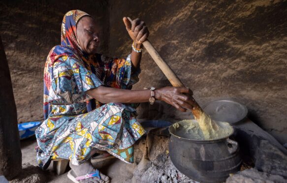 A woman cooking over a fire in Mali, West Africa.