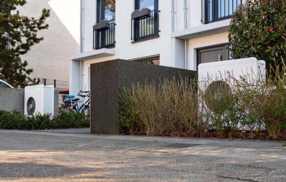 Heat pumps in the front garden of terraced houses in Duesseldorf, Germany. Image ID: 2WR3BD8.