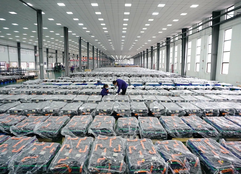 Workers inspect battery products at a lithium battery factory in Tangshan, China.