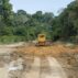 Bulldozer clears a dirt road in the Amazon near the Tapajos River in Para State, Brazil.