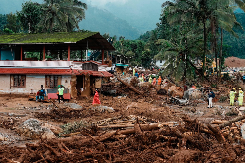 Rescuers at a damaged house in Kerala state, India, after a landslide on 31 July, 2024.