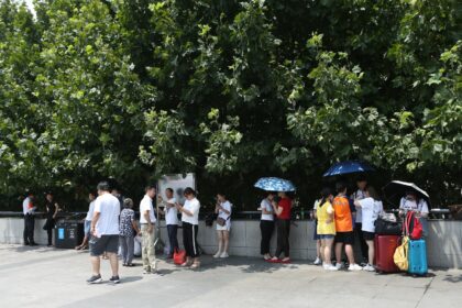 People seeking shade in Shanghai, China.