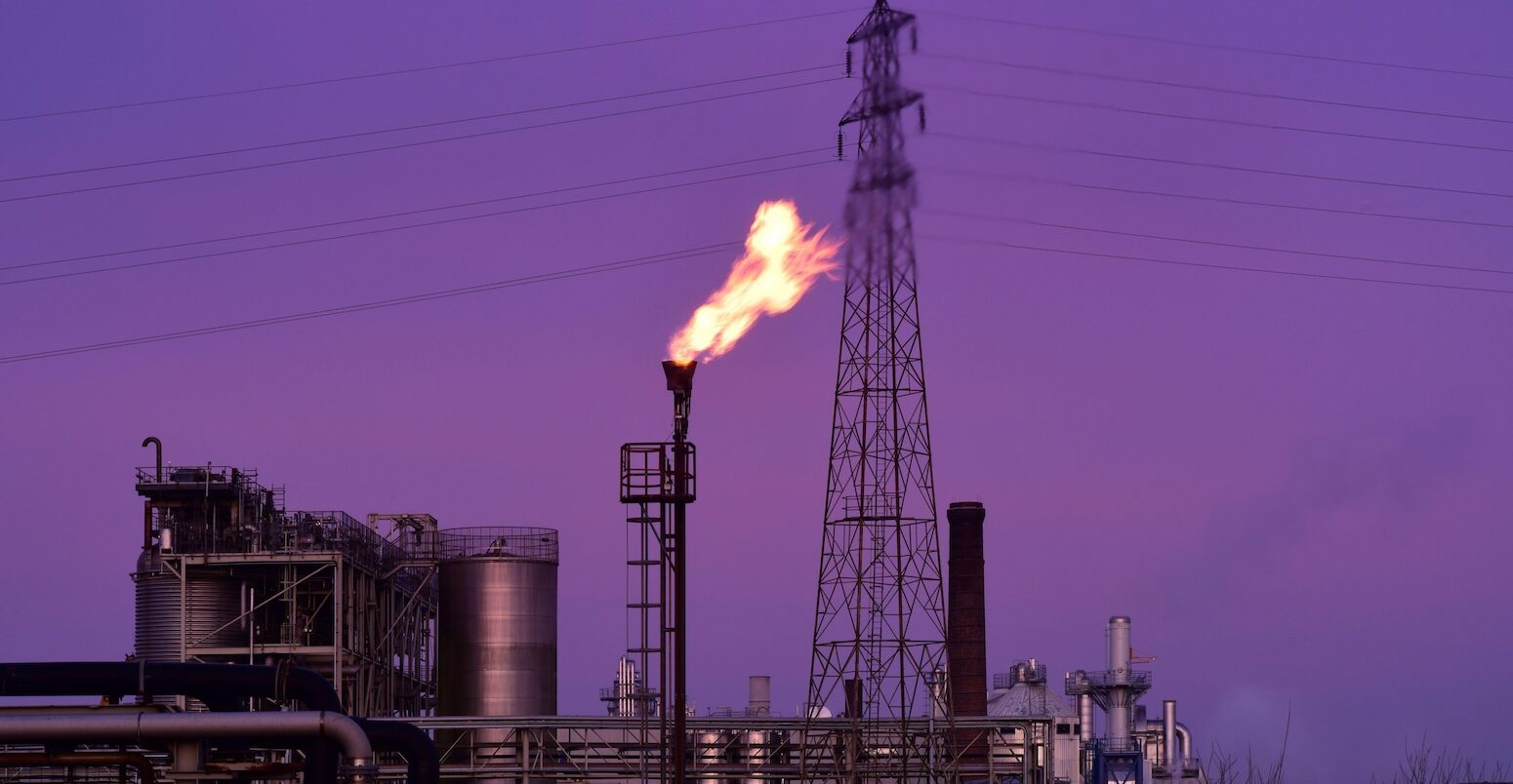 Gas flare stack burning excess gases at petrochemical plant, UK. Credit: paul ridsdale / Alamy Stock Photo. Image ID: 2D9JW8F.