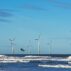 Offshore windfarm and kite surfer in Yorkshire, UK.