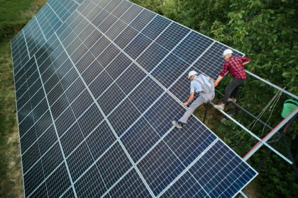 Aerial view of technicians installing solar panels.