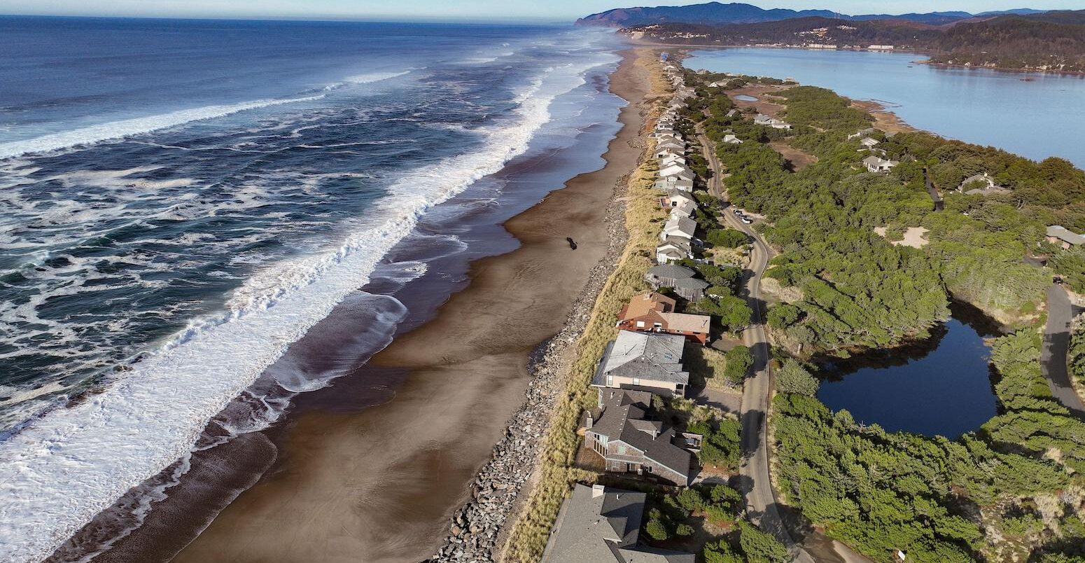 Rock shoreline structures to prevent sea level rise on the US pacific coast. Credit: Ken Hawkins / Alamy Stock Photo. Image ID: 2KTAYC1.