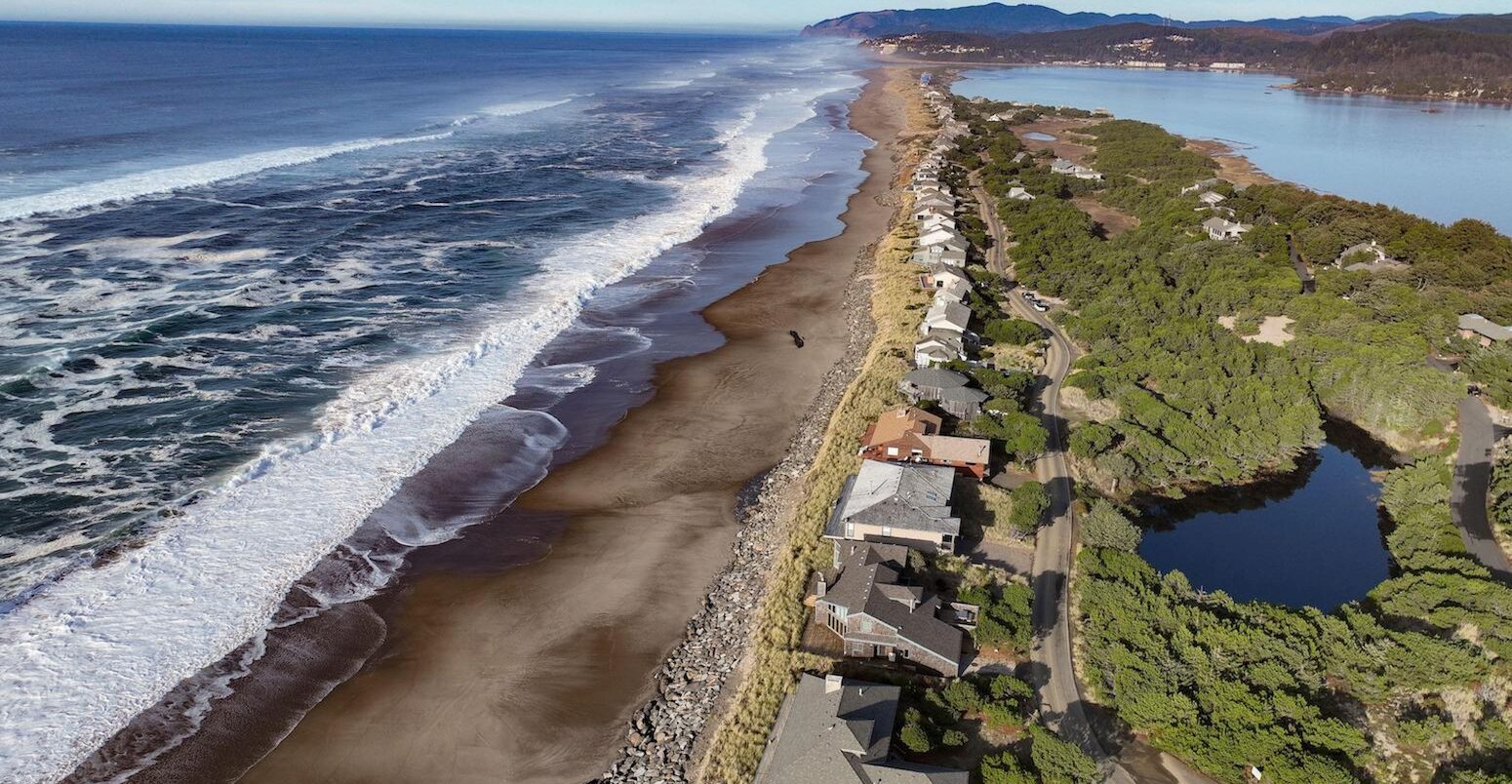 Rock shoreline structures to prevent sea level rise on the US pacific coast. Credit: Ken Hawkins / Alamy Stock Photo. Image ID: 2KTAYC1.