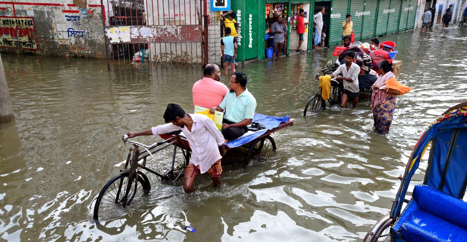 Rickshaws struggle through the flooded streets of Dhaka, Bangladesh.