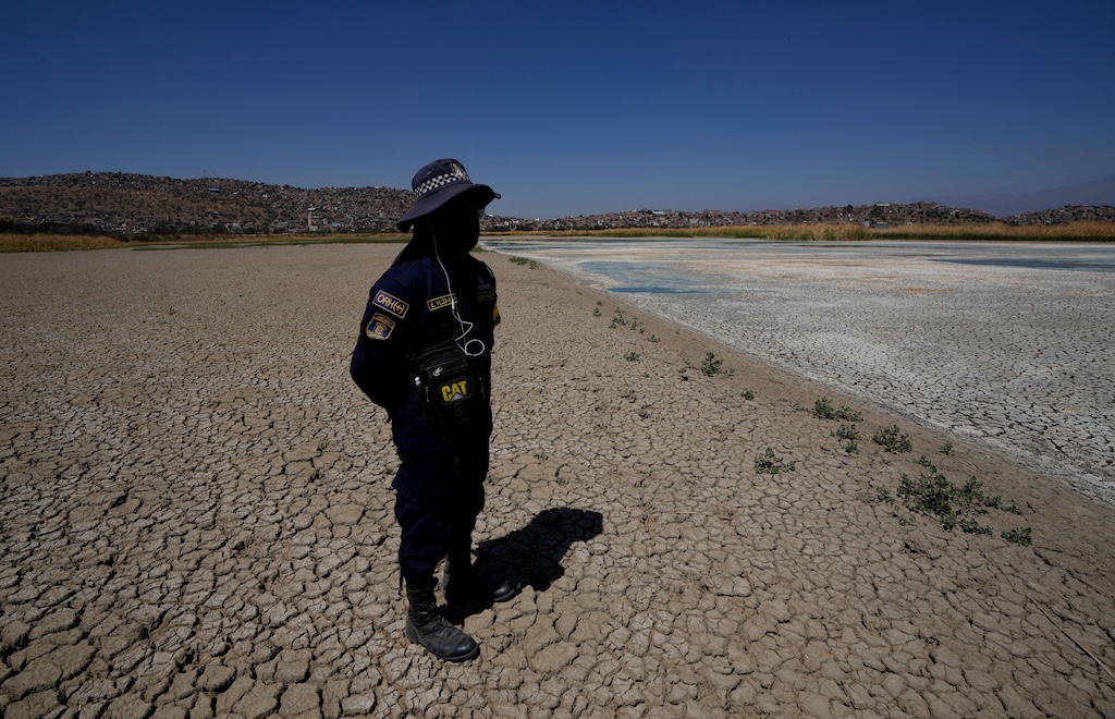 Dry cracked bed of the Alalay lagoon in Cochabamba, Bolivia.