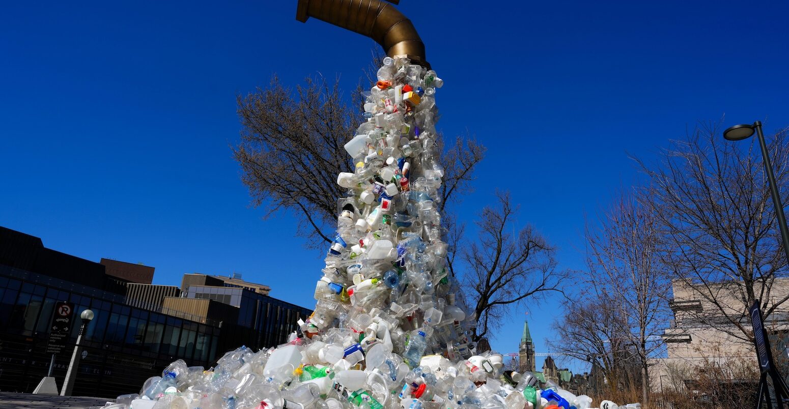 A sculpture titled "Giant Plastic Tap" by Canadian artist Benjamin Von Wong.