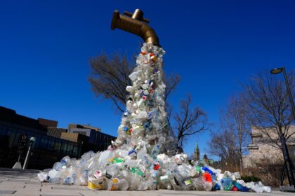 A sculpture titled "Giant Plastic Tap" by Canadian artist Benjamin Von Wong.