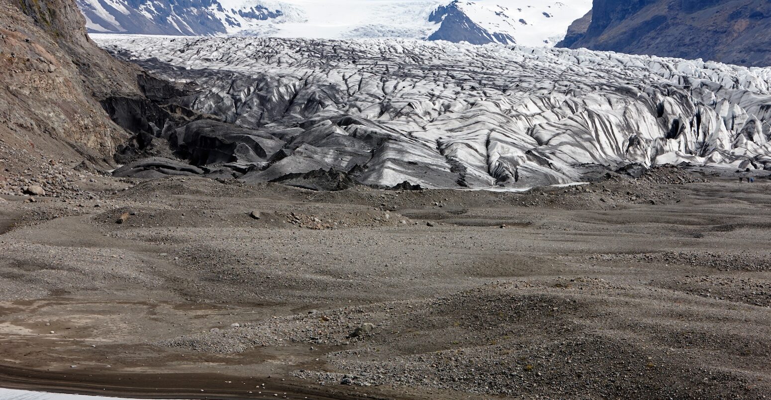 Ash covered Skaftafell glacier in Iceland.