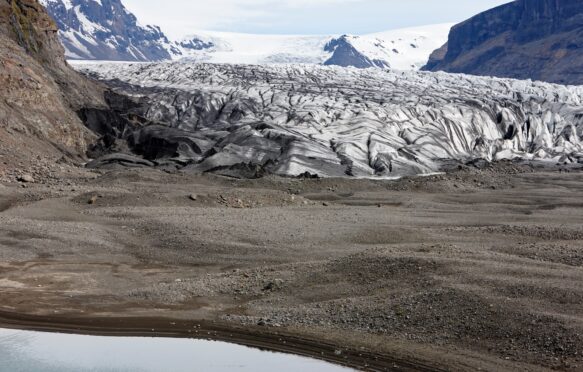 Ash covered Skaftafell glacier in Iceland.