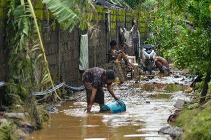 Residents cleaning the mud after tropical storm Kristine flooded Lemery, Philippines, 25 October 2024. Credit: ZUMA Press, Inc. / Alamy Stock Photo. Image ID: 2YD4WRX.