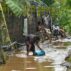 Residents cleaning the mud after tropical storm Kristine flooded Lemery, Philippines, 25 October 2024. Credit: ZUMA Press, Inc. / Alamy Stock Photo. Image ID: 2YD4WRX.