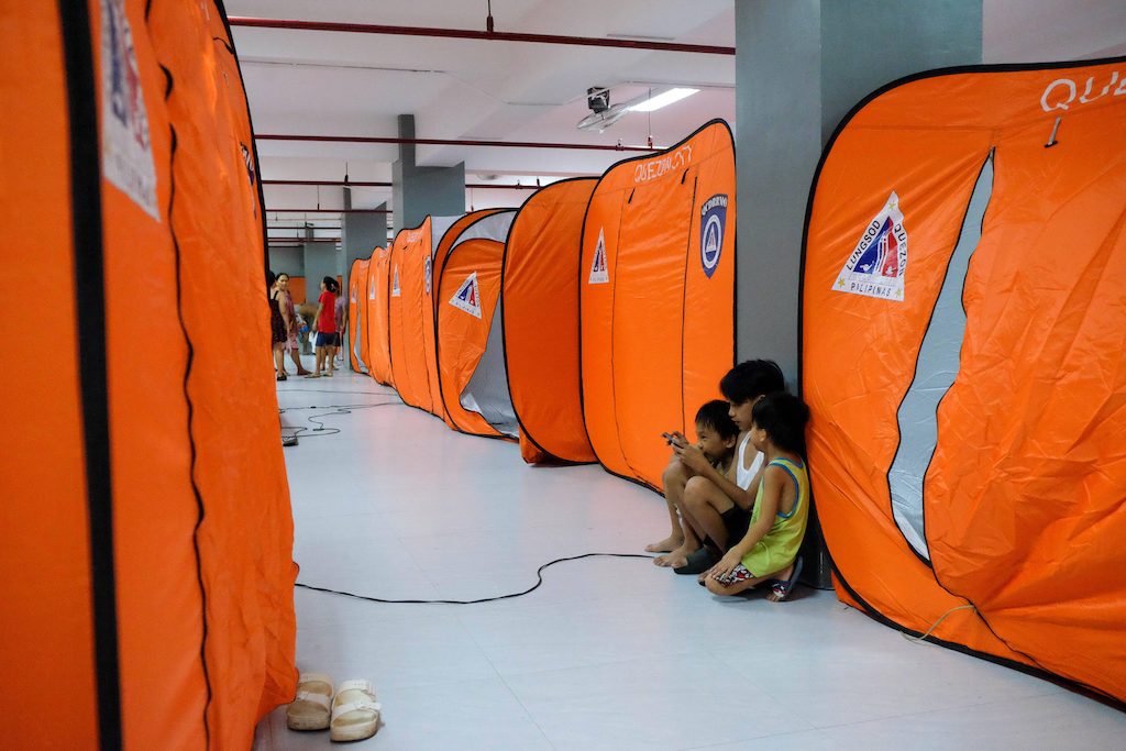 Families seeking shelter at the Bagong Silangan Evacuation Center, Philippines, due to the expected flooding in low-lying areas caused by Super Typhoon Man-yi, local name Pepito, on 17 November 2024. Credit: Imago / Alamy Stock Photo. Image ID: 2YKBK68