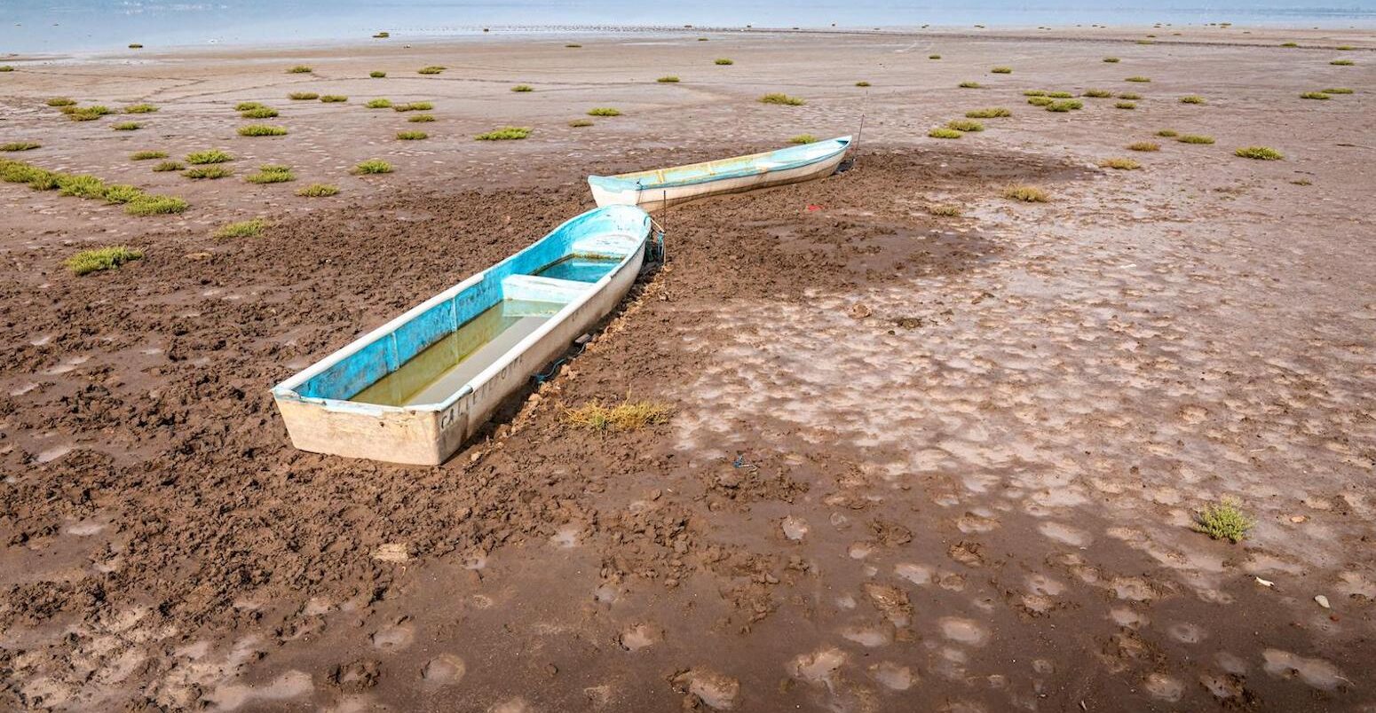 Abandoned boats on a dry lake as a result of drought in Michoacan, Mexico.