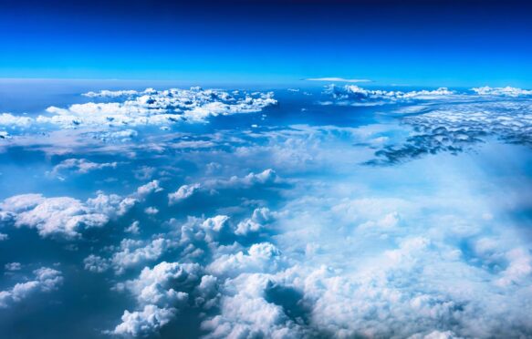 View of clouds from an aeroplane window. Credit: Feruza Tashmetova / Alamy Stock Photo. Image ID: 2YHJPPF.