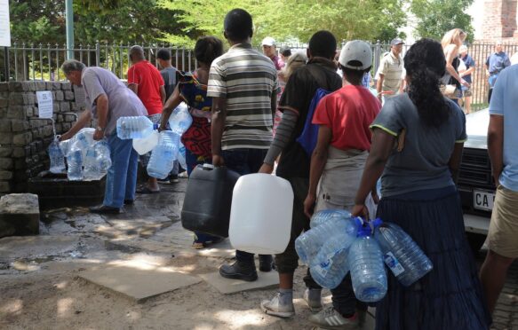 Residents queue for water at a natural spring in Cape Town, South Africa.