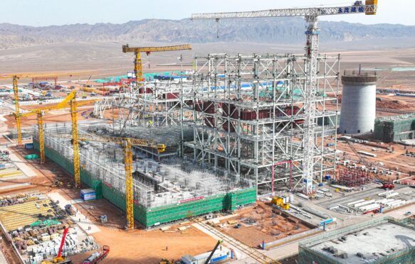 Steel structure cooling tower construction site of the coal-fired unit expansion project, Gansu Power Plant Zhangye, China. Credit: Sipa US / Alamy Stock Photo. Image ID: 2WP7PMX.