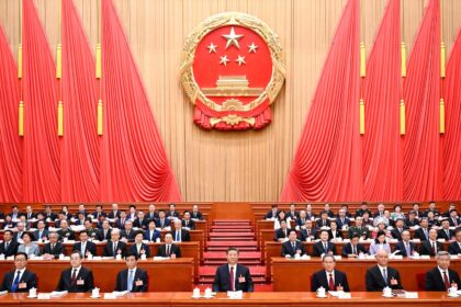 Chinese President Xi Jinping and other leaders including seated at the at the Great Hall of the People in Beijing.